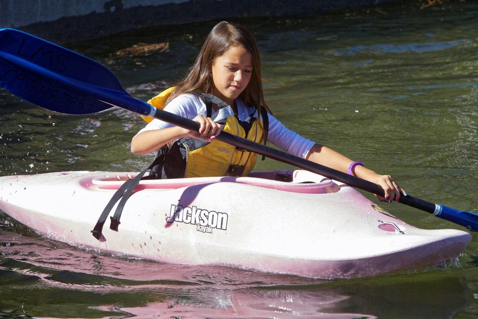 a child kayaking