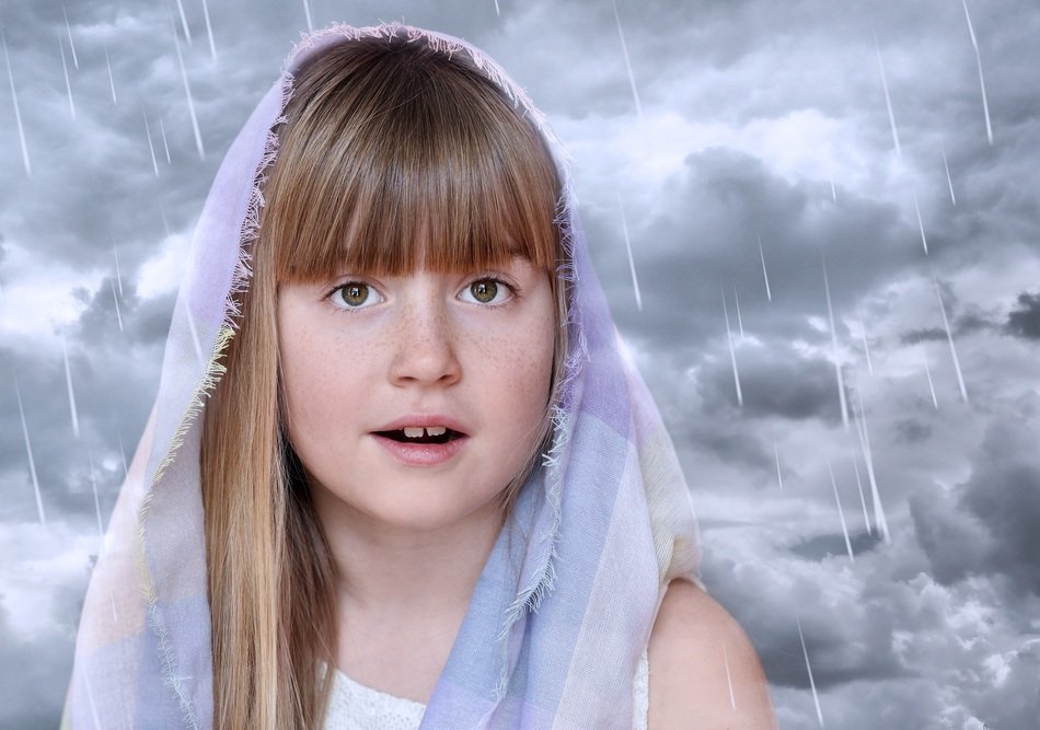 girl face on the background of clouds and rain