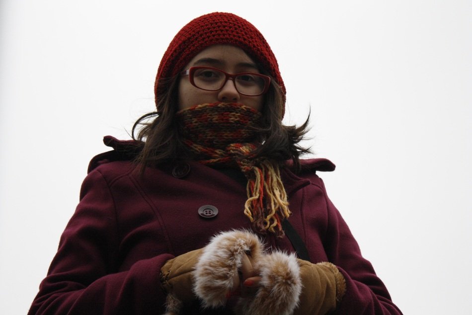 the girl in gloves was wrapped from the cold