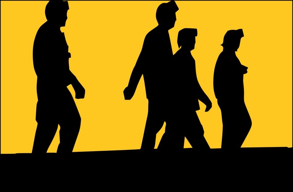 four walking men in helmets at sunset, silhouette