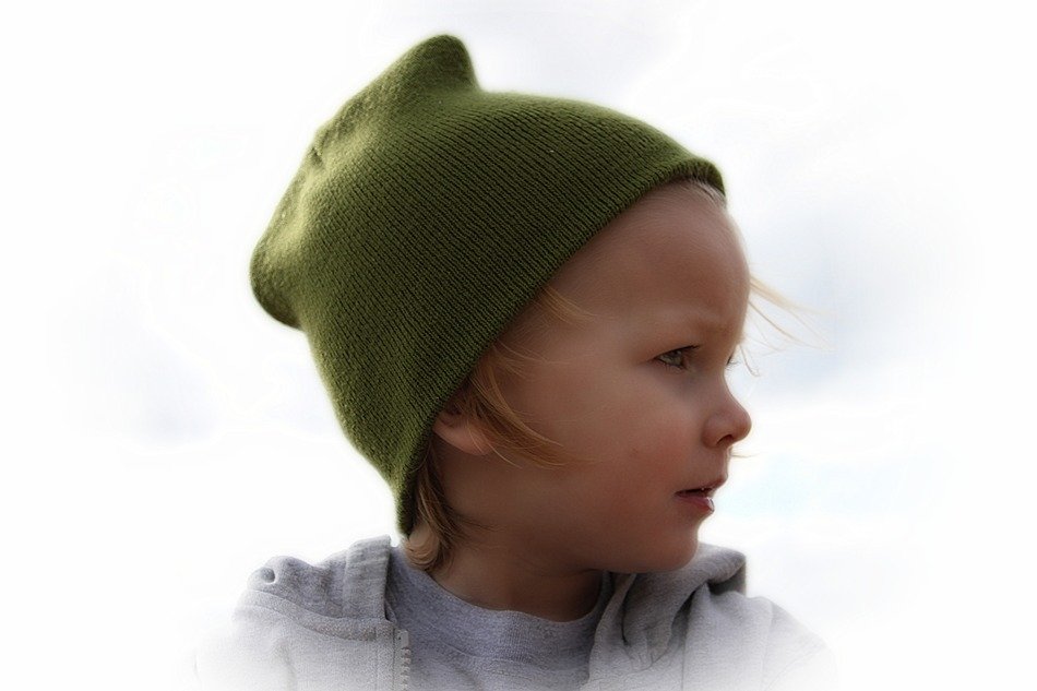 portrait of a child in a green hat