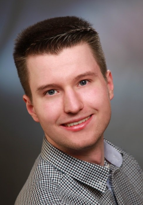 portrait of a man on a gray background