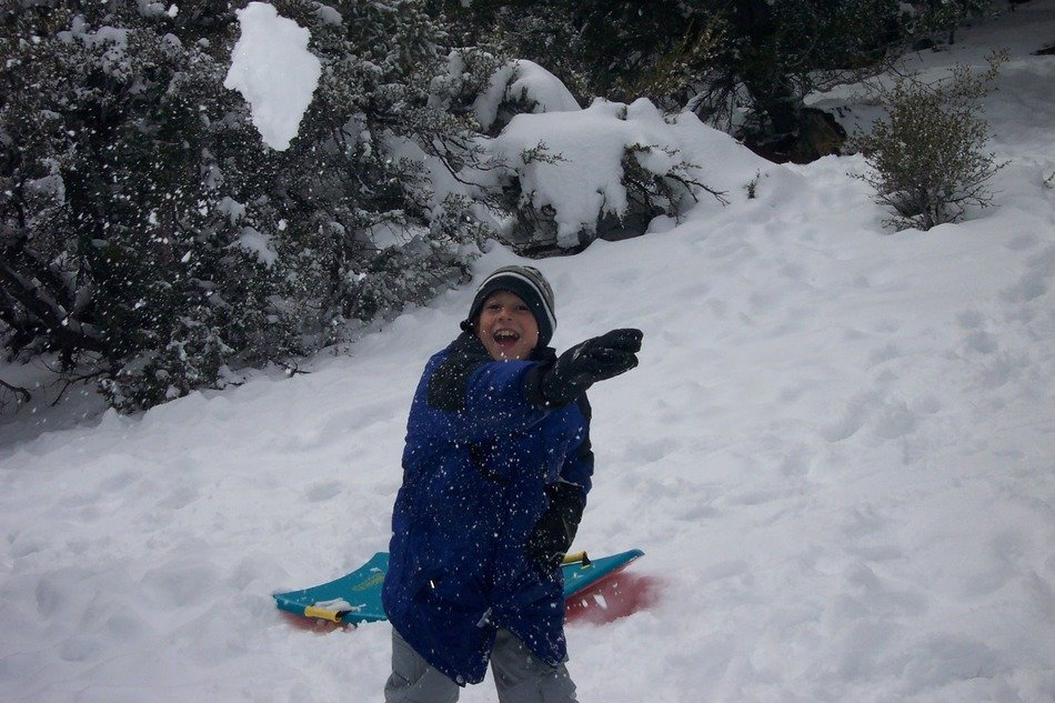 Playful boy on the snow