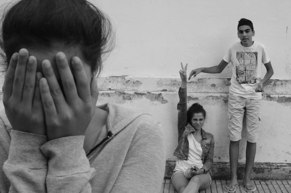 black and white photo of children playing hide and seek