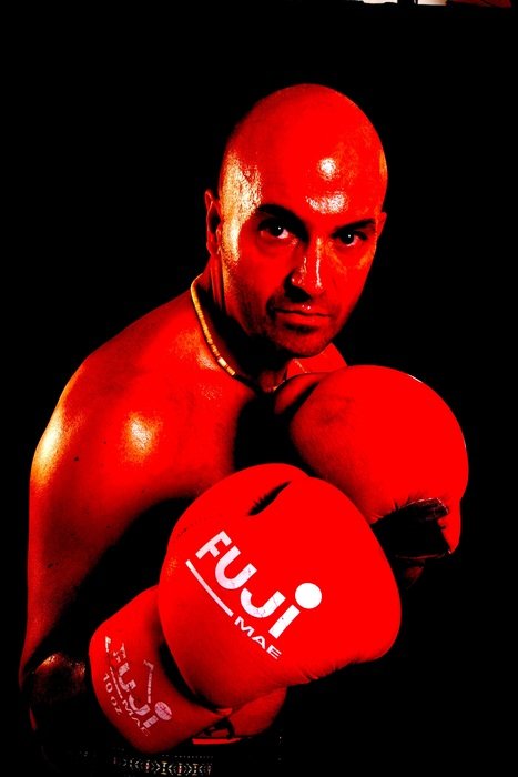 bald boxer in red