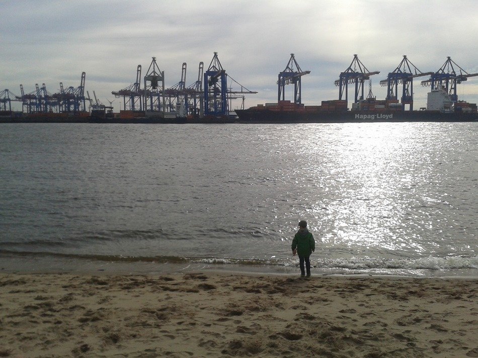 child on the beach in the port of hamburg