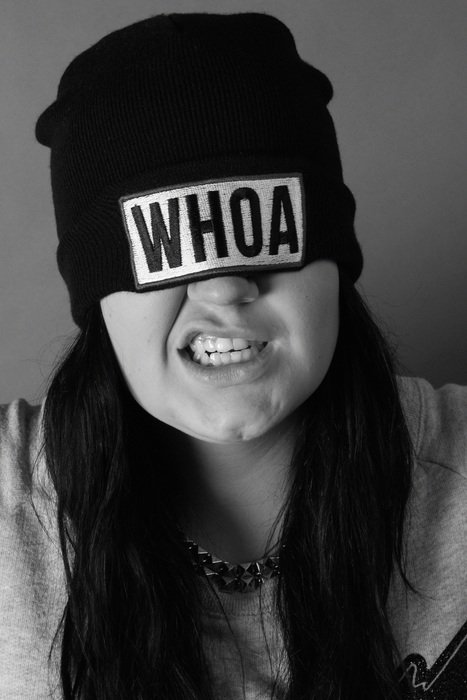 girl in a hat with the words 'whoa'