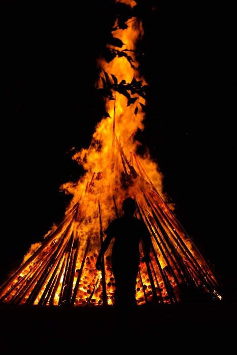 man by the huge fire