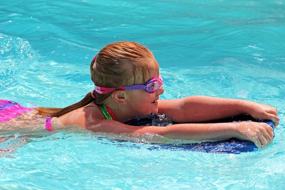 swimming girl in the pool water