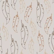Brown feathers on grey background Seamless vector pattern