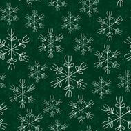 White snowflakes on green background seamless pattern