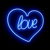 Neon heart with inscription LOVE on a black background