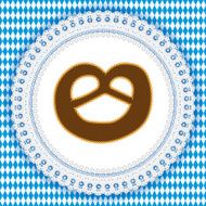 White lace doily with pretzel on a german Oktoberfest background