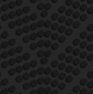 Black textured plastic dots forming chevron