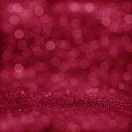 Pink festive glitter background with defocused lights