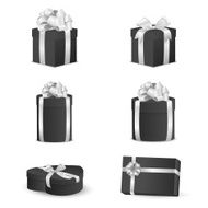 Set of black gift boxes with white bows and ribbons