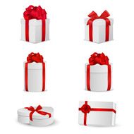 Set of white gift boxes with red bows and ribbons
