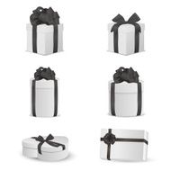 Set of white gift boxes with black bows and ribbons