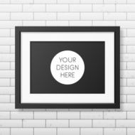 Realistic black frame A4 on the brick wall background