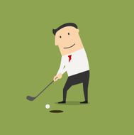 Businessman putting ball into a hole