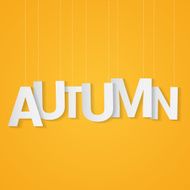 Autumn paper letters attached to string over yellow background Can