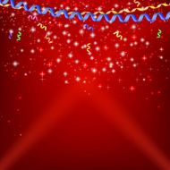 Confetti ribbons and streamers on a festive red background