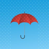 Opened red umbrella protecting from rain