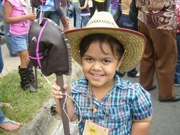 girl in a cowboy hat at the parade