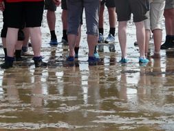 Feet of people in the mud