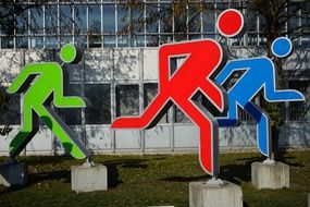 figures yellow green red group street art