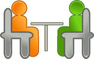 figures of people at the table in the conference hall