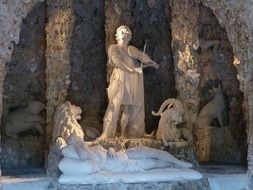 statue of Orpheus in a cave