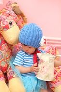 portrait of asian child girl with jar