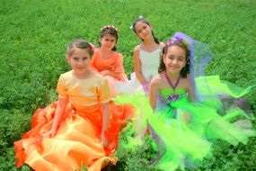 girls like princesses in colorful dresses symbolize the seasons