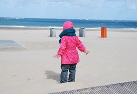 child on white beach