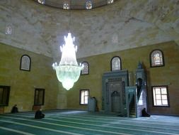 Big chandelier in the prayer hall in the mosque