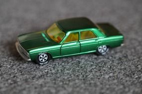 green toy car siku