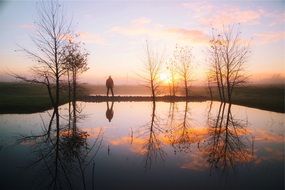 Man is looking to sunset
