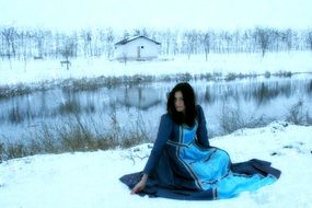 girl in a Princess costume posing in the snow