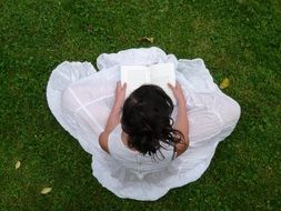 girl in white reading