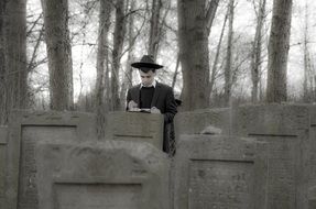 Jew man walks on the cementary