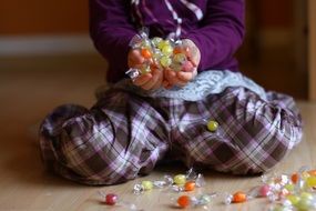 child with candy colorful