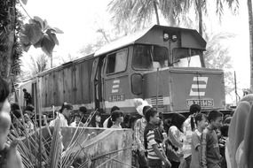 train locomotive and people in black and white background