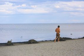 man walking on the beach