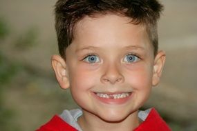 Child is showing the teeth