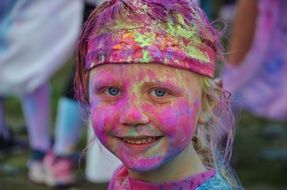 stained paint the girl&#039;s face at the festival
