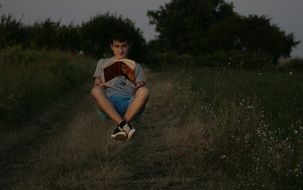 photo of the levitation of the boy and the book