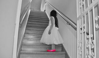 girl in a white dress on the stairs