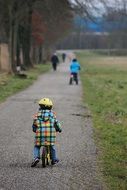 child on the run bike in the park