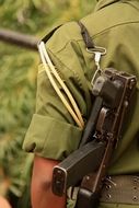 gun on the back of a soldier